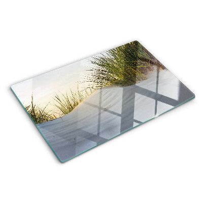 Szklana deska kuchenna z motywem zielonej trawy na tle nieba