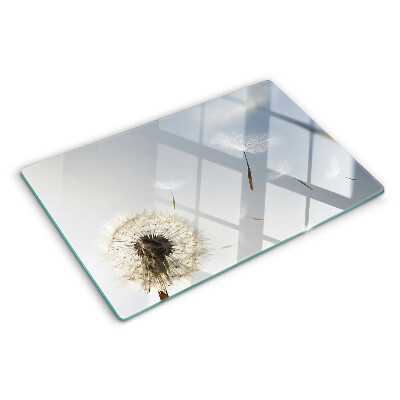 Deska kuchenna szklana z nadrukiem dmuchawców na tle okna