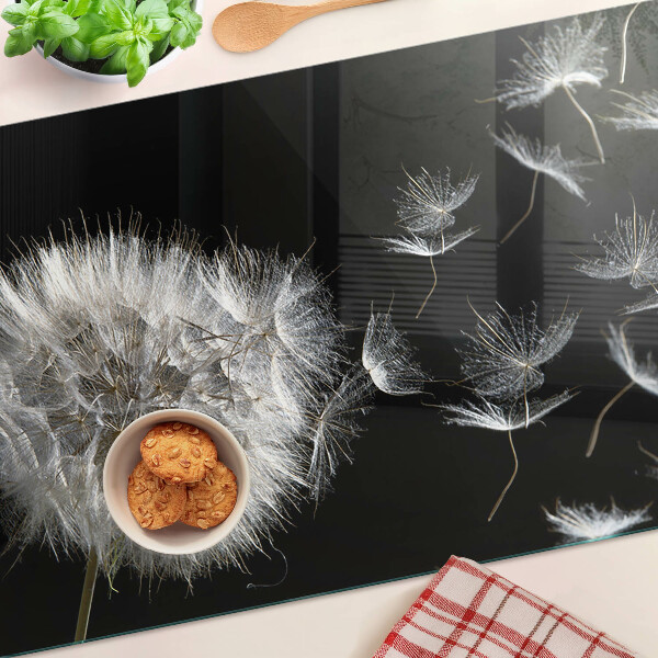 Deska kuchenna szklana z motywem dmuchawców na czarnym tle