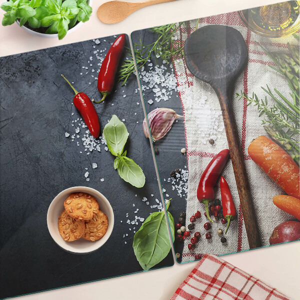 Szklana deska kuchenna z dekoracją przedstawiającą kuchenne przyprawy i warzywa