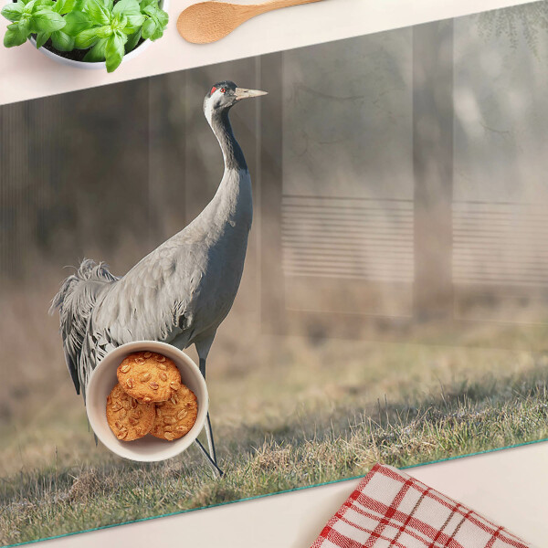 Deska kuchenna szklana z nadrukiem żurawia na tle krajobrazu