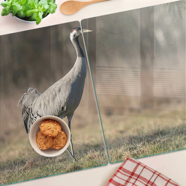 Deska kuchenna szklana z nadrukiem żurawia na tle krajobrazu