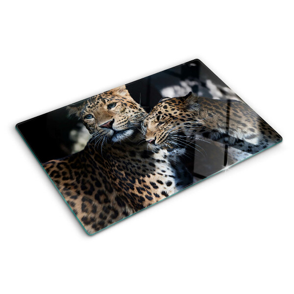 Szklana deska kuchenna z motywem gepardów na ciemnym tle