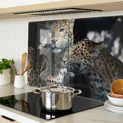 Szklana deska kuchenna z motywem gepardów na ciemnym tle