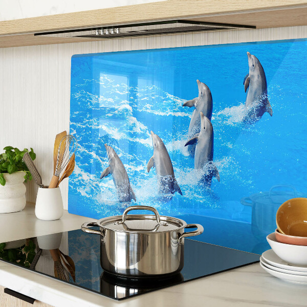 Szklana deska kuchenna z motywem delfinów skaczących przez fale