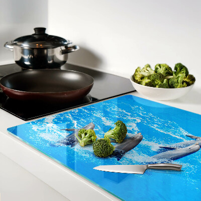 Szklana deska kuchenna z motywem delfinów skaczących przez fale