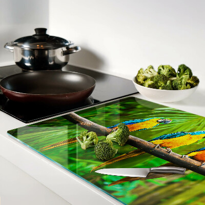 Szklana deska kuchenna z motywem papug siedzących na gałęzi w tropikalnym wnętrzu