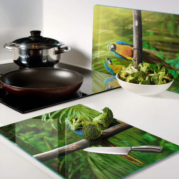 Szklana deska kuchenna z motywem papug siedzących na gałęzi w tropikalnym wnętrzu