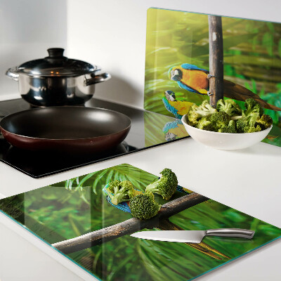 Szklana deska kuchenna z motywem papug siedzących na gałęzi w tropikalnym wnętrzu