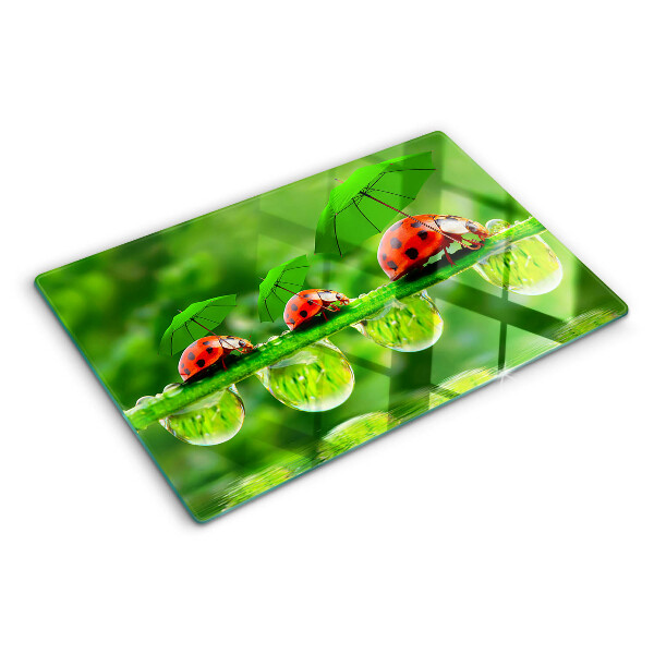 Deska kuchenna szklana z motywem biedronek na liściach z kroplami wody