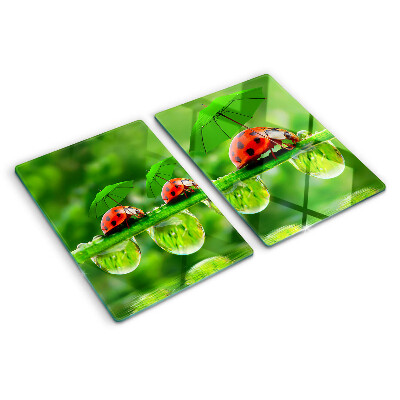 Deska kuchenna szklana z motywem biedronek na liściach z kroplami wody