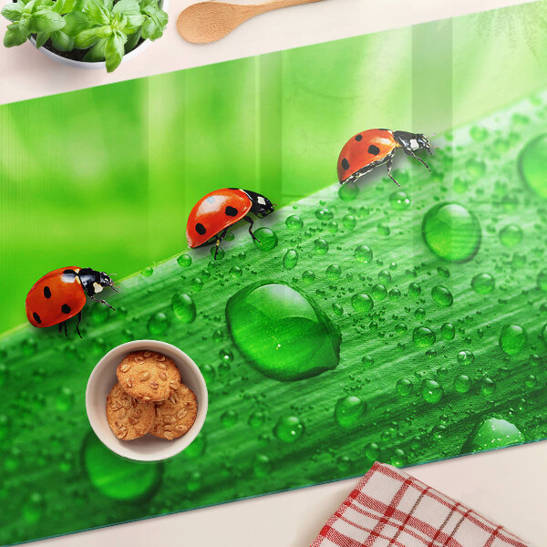 Deska kuchenna szklana z motywem biedronek na zielonym tle