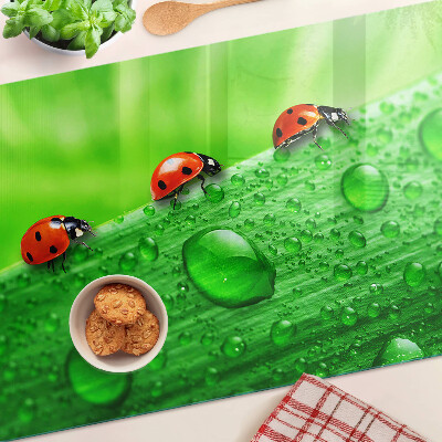 Deska kuchenna szklana z motywem biedronek na zielonym tle