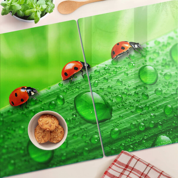 Deska kuchenna szklana z motywem biedronek na zielonym tle
