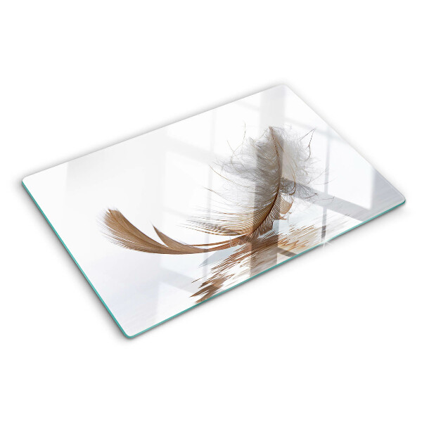 Deska kuchenna szklana z motywem pióra na tle wody