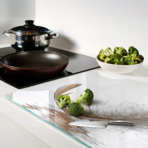 Deska kuchenna szklana z motywem pióra na tle wody