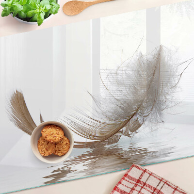 Deska kuchenna szklana z motywem pióra na tle wody