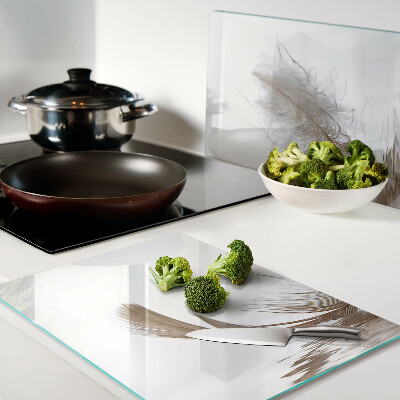 Deska kuchenna szklana z motywem pióra na tle wody