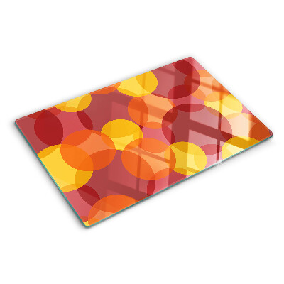 Szklana deska kuchenna z motywem kolorowych okręgów w ciepłych tonach