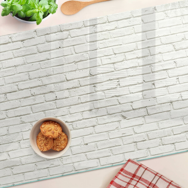 Szklana deska do krojenia z nadrukiem ceglanej ściany w białym kolorze