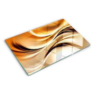 Szklana deska kuchenna z motywem abstrakcyjnych fal w odcieniach złota