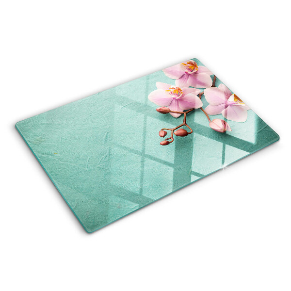 Szklana deska kuchenna z motywem orchidei na niebieskim tle