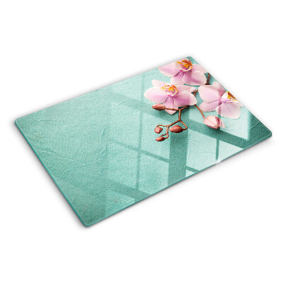 Szklana deska kuchenna z motywem orchidei na niebieskim tle