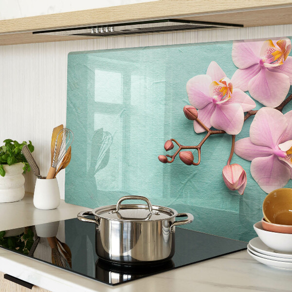 Szklana deska kuchenna z motywem orchidei na niebieskim tle
