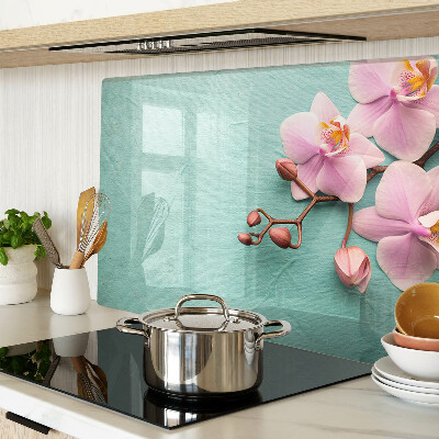 Szklana deska kuchenna z motywem orchidei na niebieskim tle