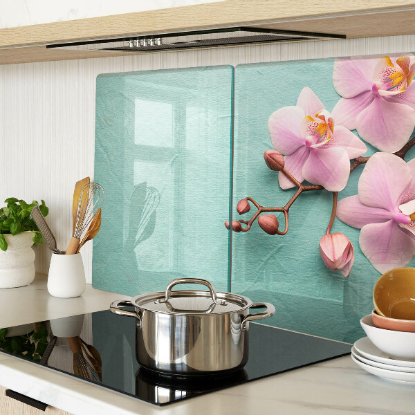 Szklana deska kuchenna z motywem orchidei na niebieskim tle