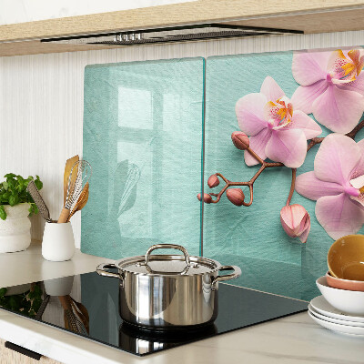 Szklana deska kuchenna z motywem orchidei na niebieskim tle