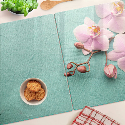 Szklana deska kuchenna z motywem orchidei na niebieskim tle