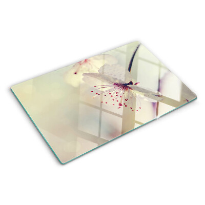 Szklana deska kuchenna z motywem kwiatowym na tle geometrycznym