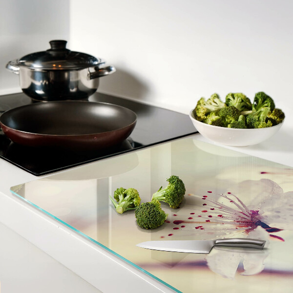 Szklana deska kuchenna z motywem kwiatowym na tle geometrycznym