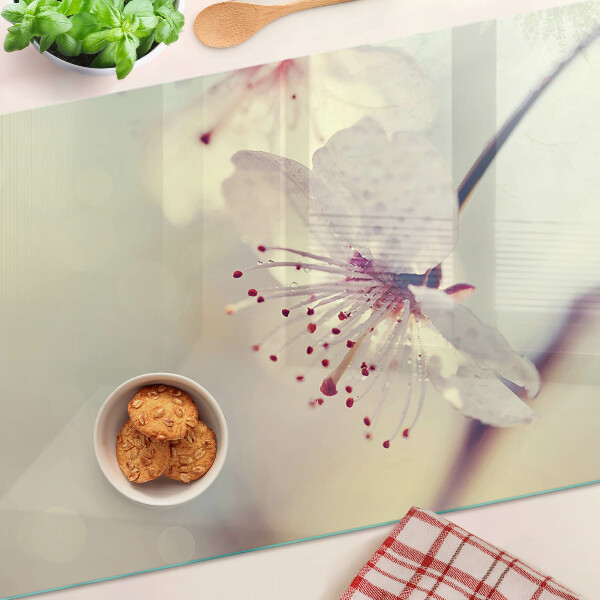 Szklana deska kuchenna z motywem kwiatowym na tle geometrycznym