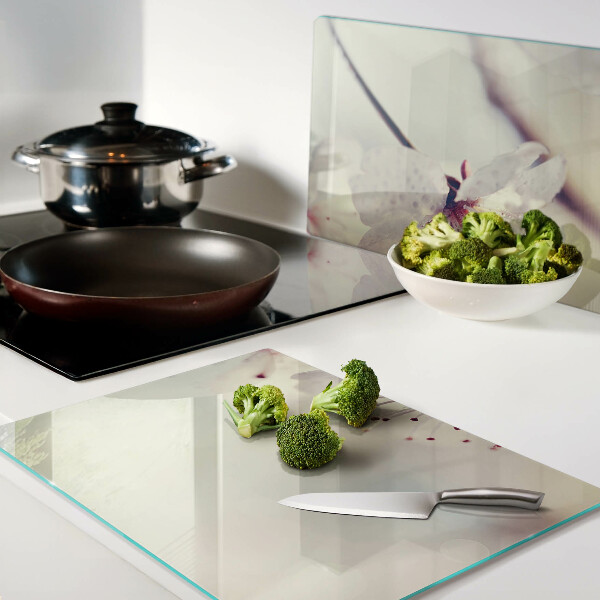 Szklana deska kuchenna z motywem kwiatowym na tle geometrycznym