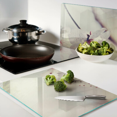 Szklana deska kuchenna z motywem kwiatowym na tle geometrycznym