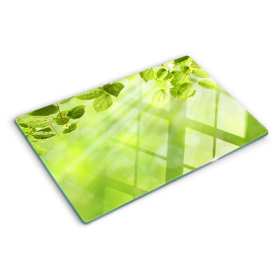 Szklana deska do krojenia z motywem zielonych liści na jasnym tle