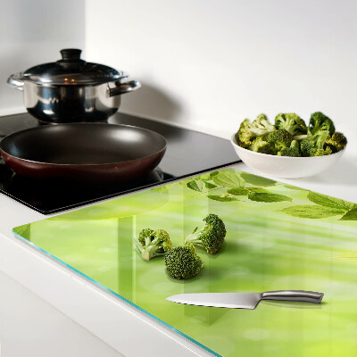 Szklana deska do krojenia z motywem zielonych liści na jasnym tle