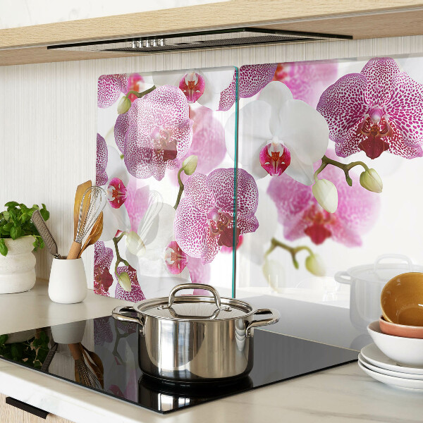 Szklana deska do krojenia z motywem orchidei na tle okna