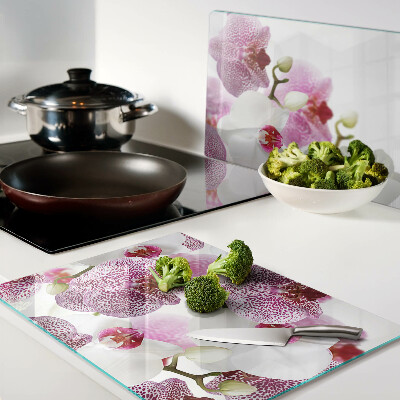 Szklana deska do krojenia z motywem orchidei na tle okna