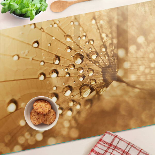 Szklana deska kuchenna z motywem kropli wody na mniszku lekarskim