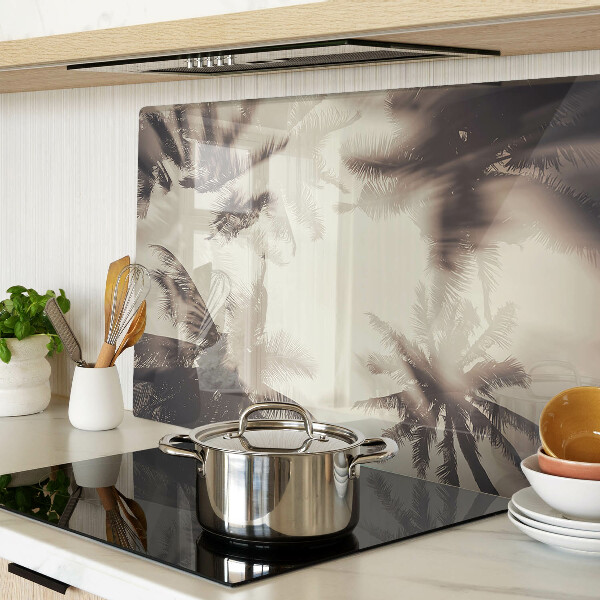Szklana deska kuchenna z motywem palm na tle monochromatycznym