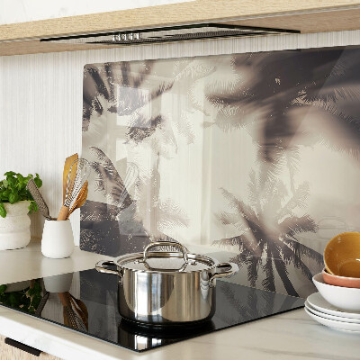 Szklana deska kuchenna z motywem palm na tle monochromatycznym