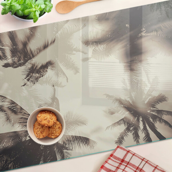 Szklana deska kuchenna z motywem palm na tle monochromatycznym