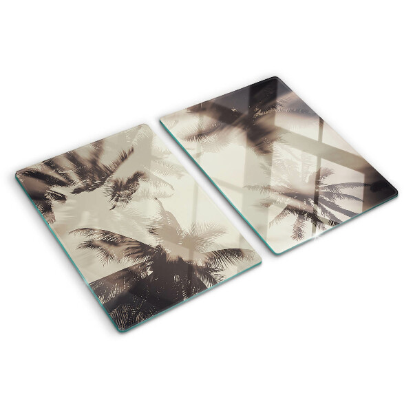 Szklana deska kuchenna z motywem palm na tle monochromatycznym