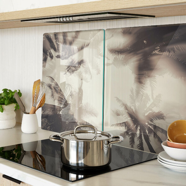 Szklana deska kuchenna z motywem palm na tle monochromatycznym