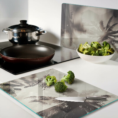 Szklana deska kuchenna z motywem palm na tle monochromatycznym