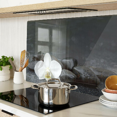 Szklana deska do krojenia z motywem kwiatu orchidei na kamieniach