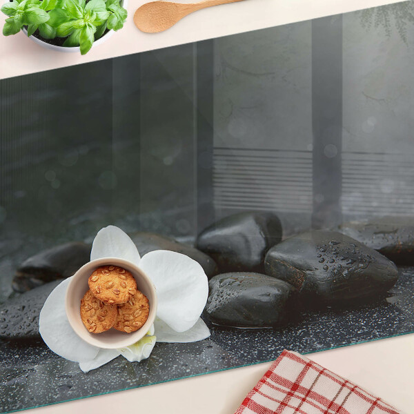 Szklana deska do krojenia z motywem kwiatu orchidei na kamieniach